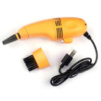 USB mini vacuum cleaner shown with packaging, highlighting its portability.