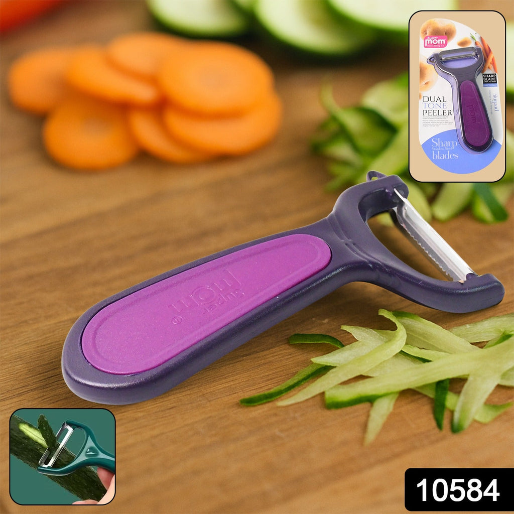 Close-up of vegetable peeler showing sharp metal blade and stylish dual tone handle