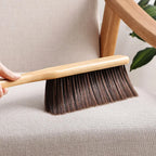 Side view of a soft bristle dust cleaning brush, highlighting its comfortable handle.