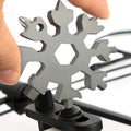 Compact stainless steel Snowflake Multi-Tool, showcasing its 18 functions.