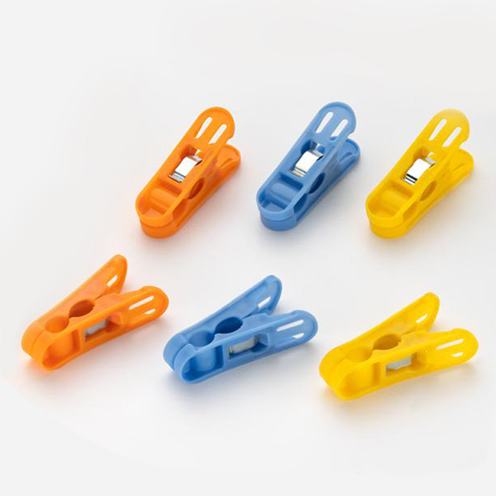 Durable non-slip plastic clips for laundry drying in bright colours.