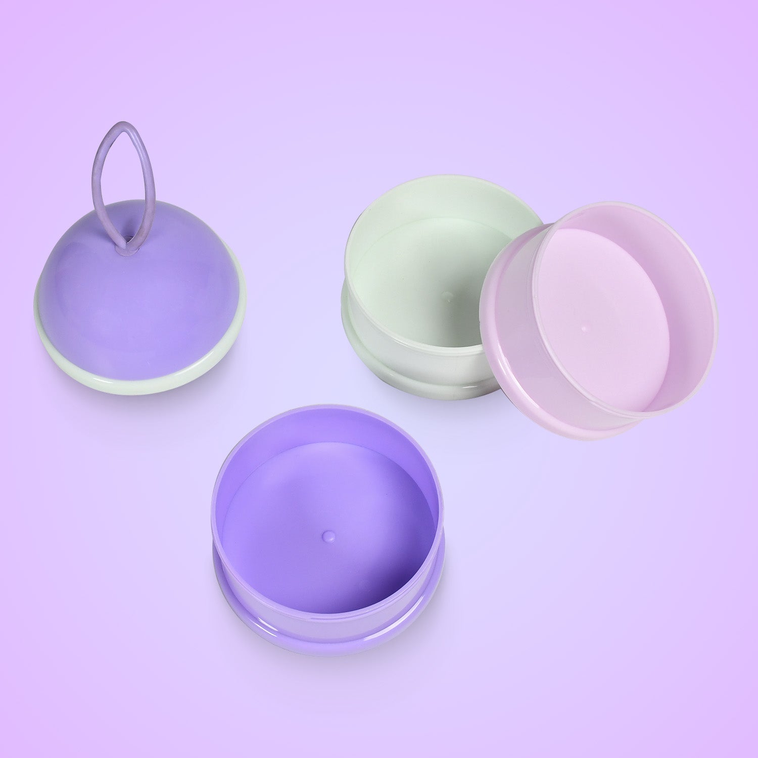 Opened baby food container displaying three separate sections for organized snacks.