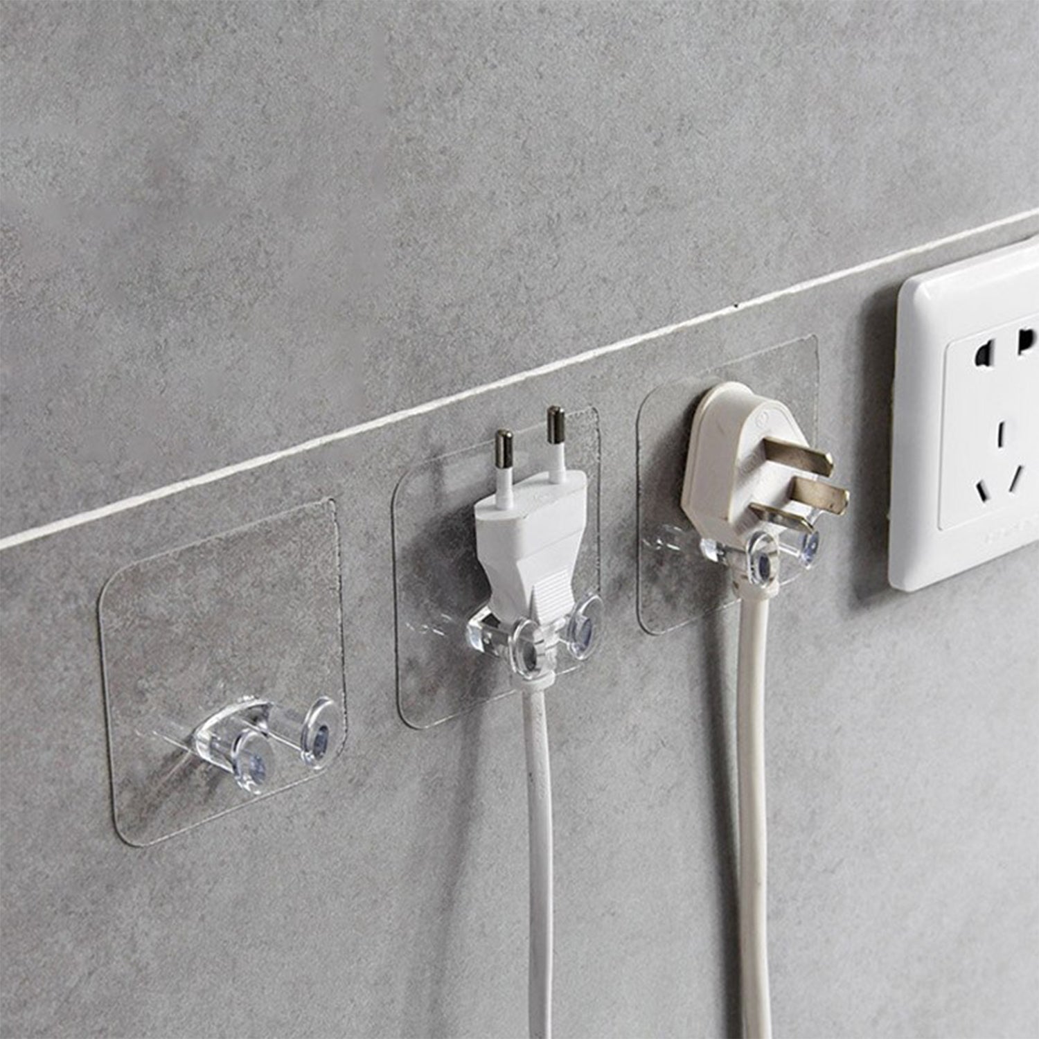 Set of transparent wall storage hooks arranged in a kitchen for efficient organization.