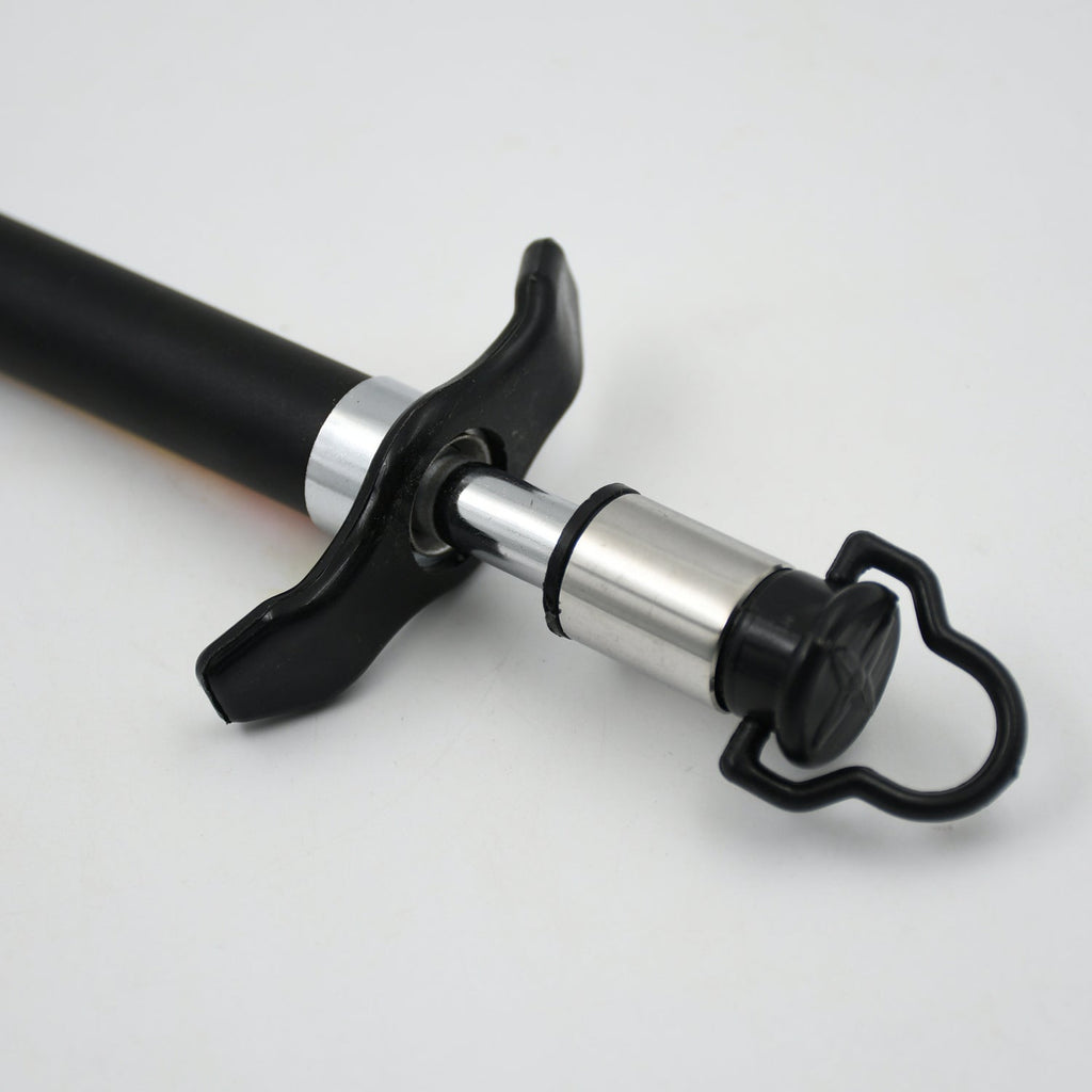 Close-up of the stainless steel gas lighter producing a reliable spark for ignition.