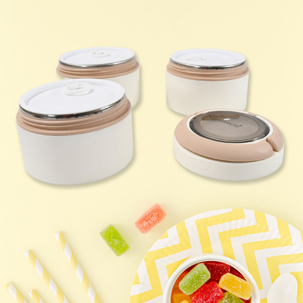 The Ganesh stainless steel lunch box on a table, ready for an office meal or school break.