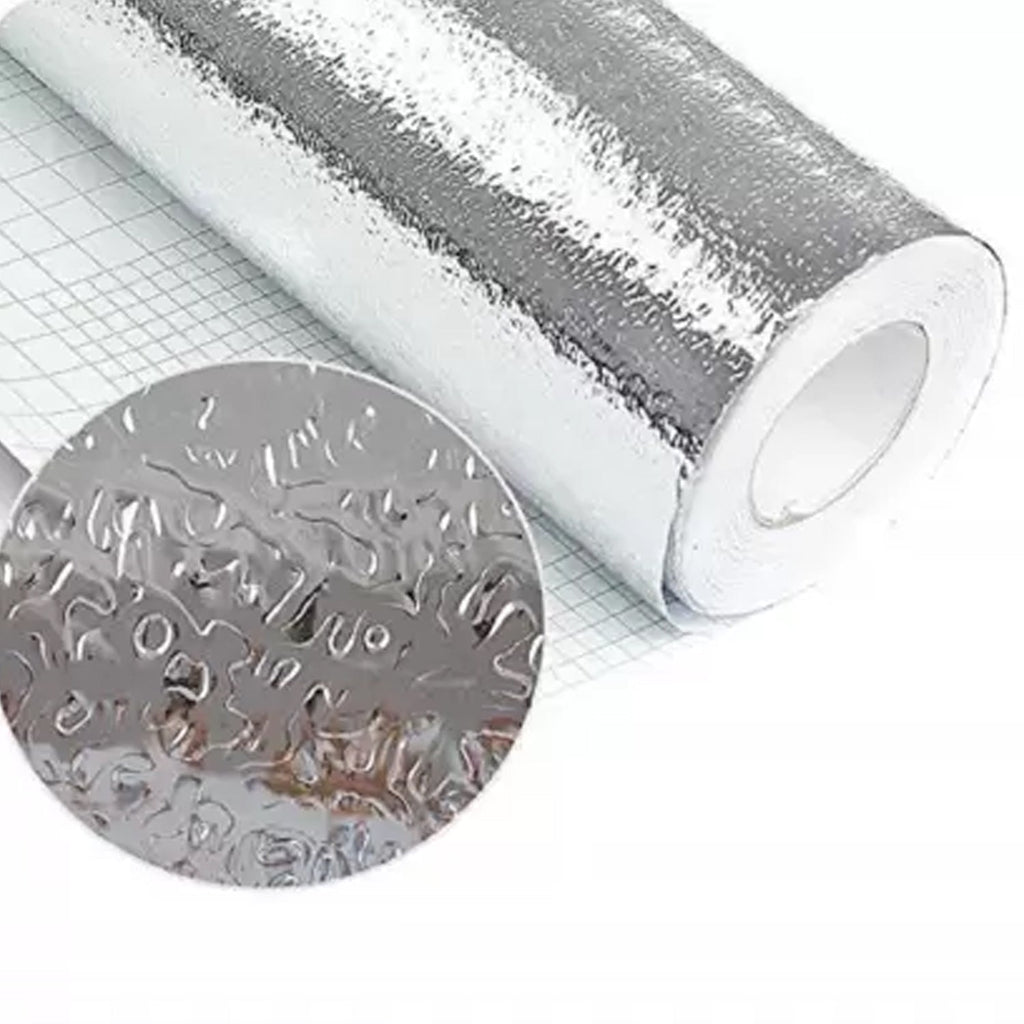Aluminium kitchen foil applied to a kitchen drawer for protection.