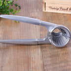 Close-up of a luxury stainless steel walnut cracker with an ergonomic and efficient design.