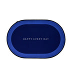 Oval shaped non-slip bath mat positioned on bathroom floor