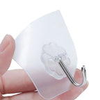 A cluster of small, durable stainless steel adhesive wall hooks in a 100-piece pack.