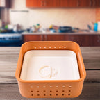 Compact Square Paneer Maker placed on a kitchen counter, ready for use.