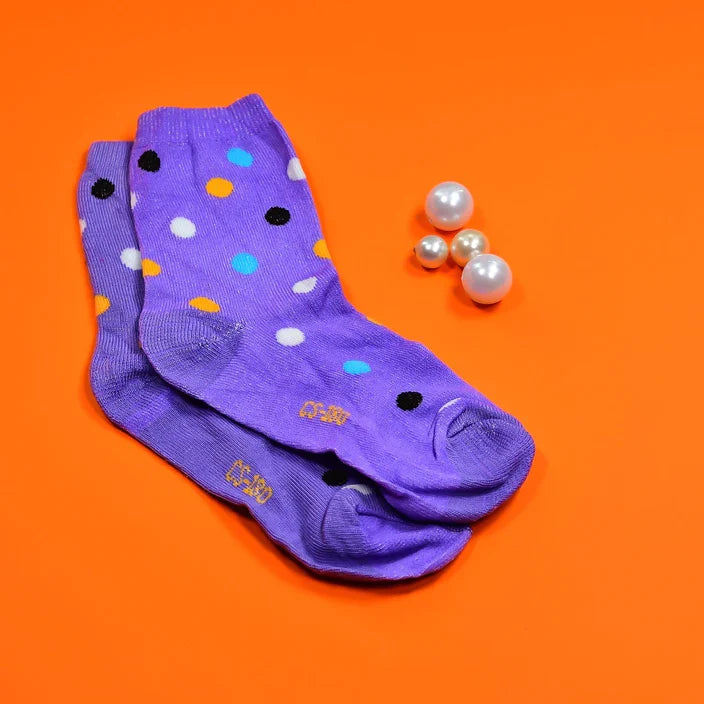 Two pairs of trendy designer socks for women, showcasing different fun prints.