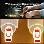 Wall mounted oil dispenser bottle with clear capacity markings.