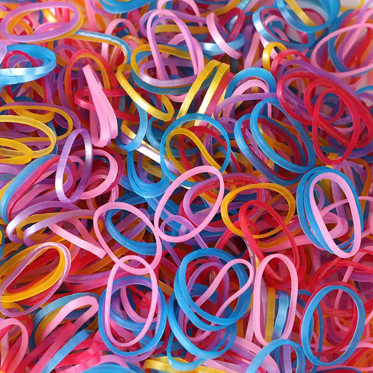 Vibrant multicolor rubber bands neatly stacked in a pile.