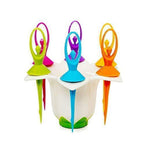 The elegant dancing doll stand holding the six reusable fruit picks, ready for use.