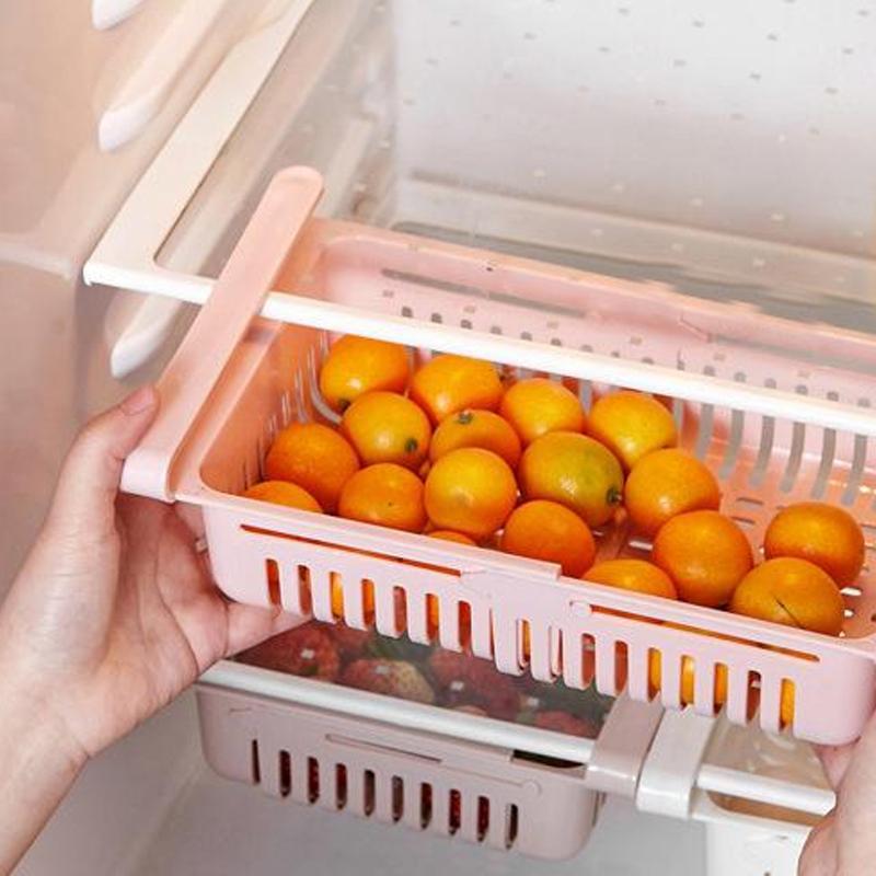 A single fridge organizer drawer filled with snacks and small items.