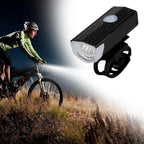 USB rechargeable bicycle headlight mounted on handlebars.
