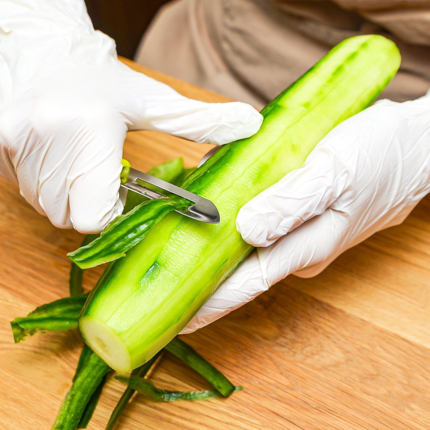 The Ganesh stainless steel kitchen tools: knife, peeler, and gas lighter.