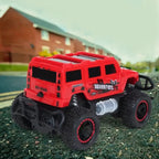 Dynamic RC stunt car performing a 180-degree flip with its remote control.