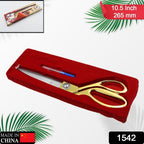 Golden tailoring scissors with stainless steel blades precisely cutting a piece of fabric.