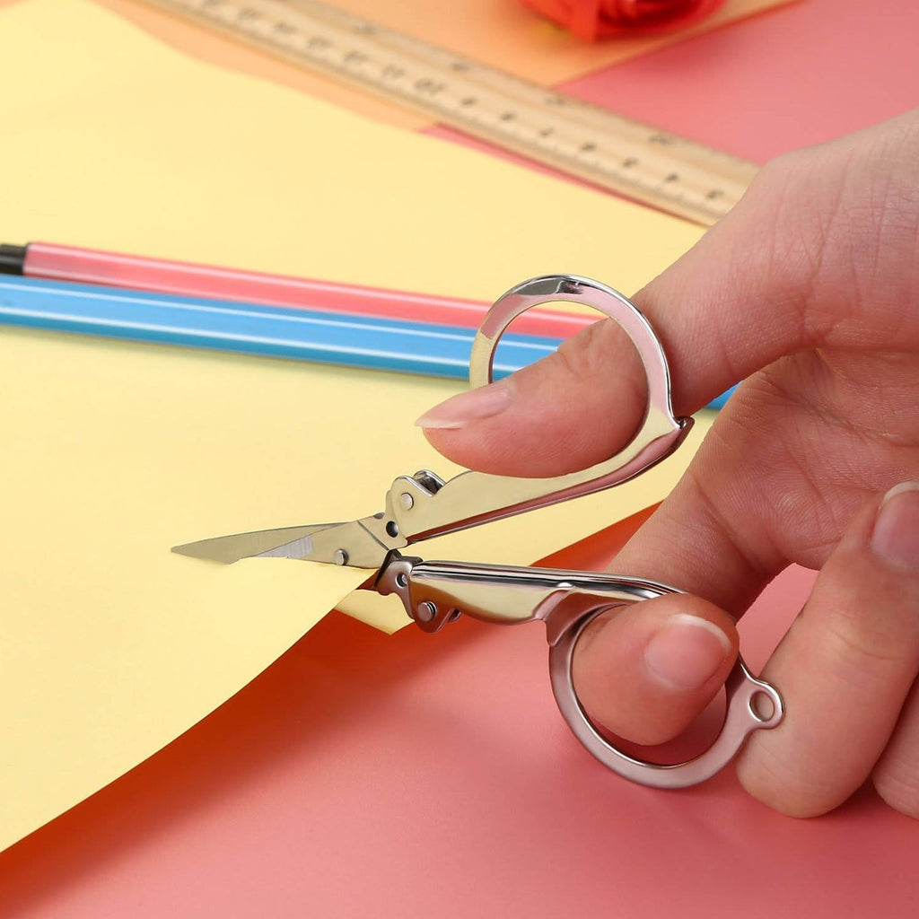 The 3.5-inch folding scissor demonstrating its smooth cutting action.