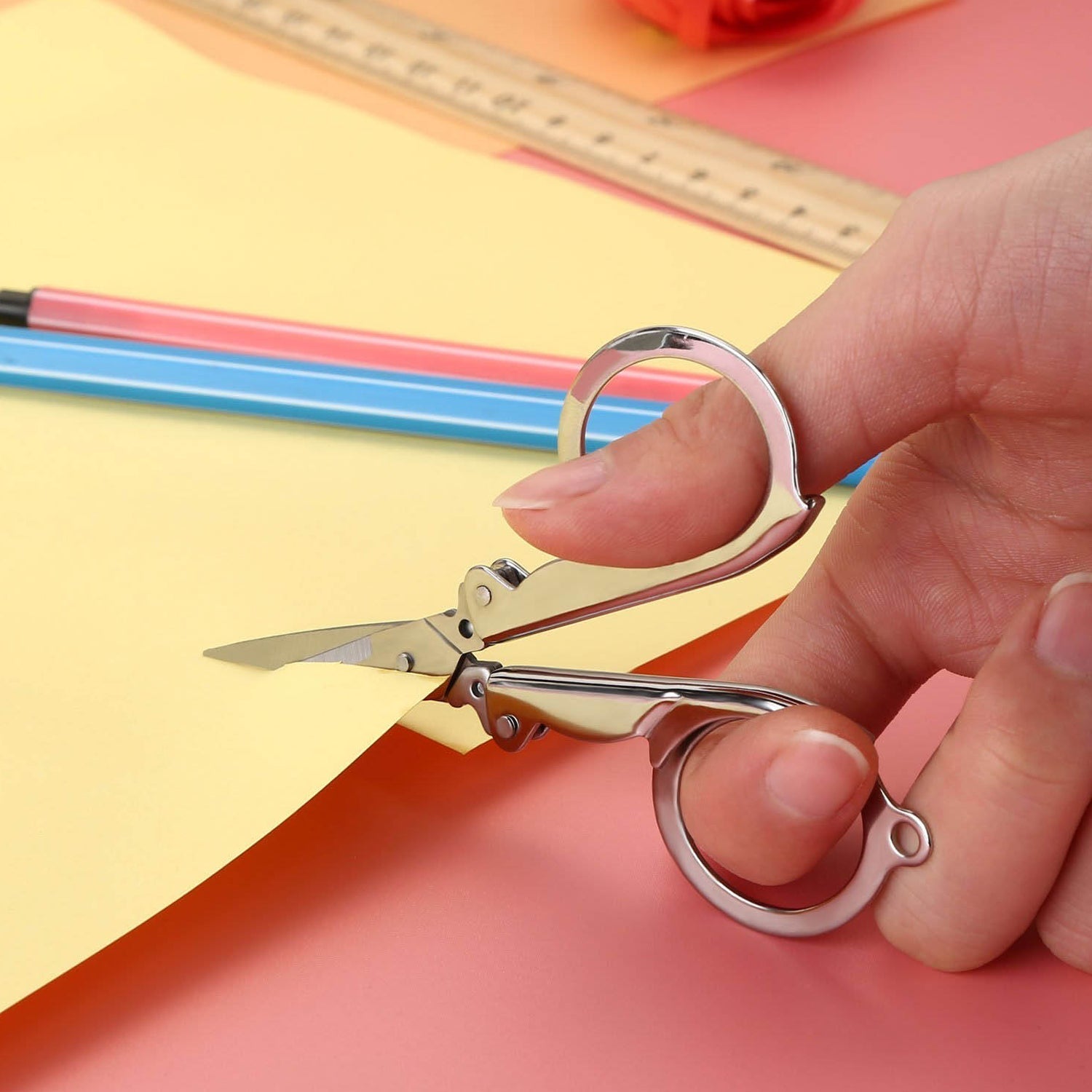 The 3.5-inch folding scissor demonstrating its smooth cutting action.