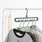 Front view of the Organivo 9-hole plastic hanger, showcasing its multi-slot design.