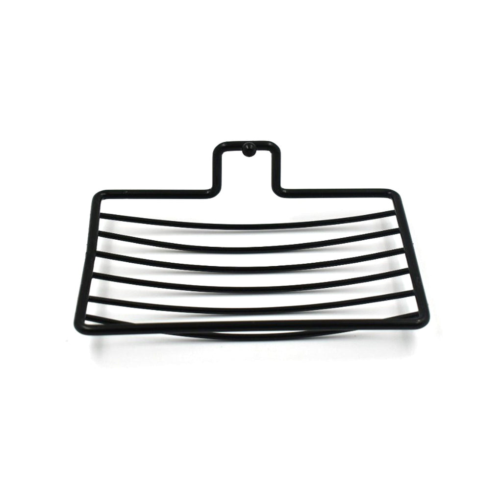 Wall mount soap rack holding a bar of soap, demonstrating its secure grip and drainage.