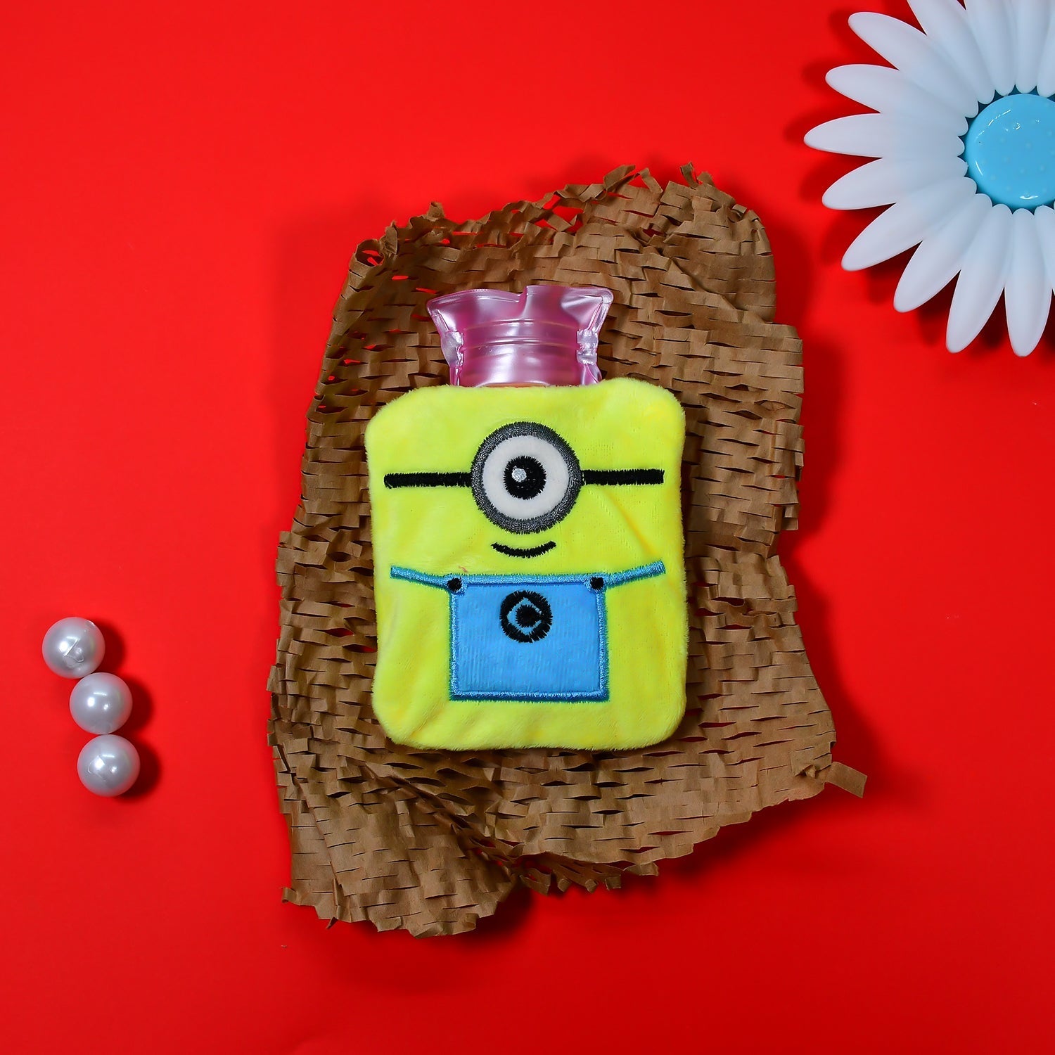 Front view of the Minions hot water bottle, providing warmth for hands and feet.