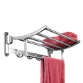 Stainless steel folding towel rack with 18-inch bar mounted in a modern bathroom.