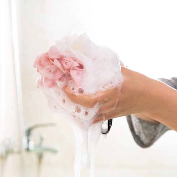 Close-up of a round bath loofah, perfect for exfoliating skin.