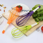 Ergonomic plastic balloon whisk for milk, coffee, and egg mixing by Quickslice.