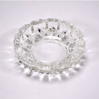 Stylish clear glass ashtray on a tabletop, enhancing home or office decor.