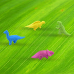 Multiple animal erasers shaped like dinosaurs, showcasing various colours and designs.
