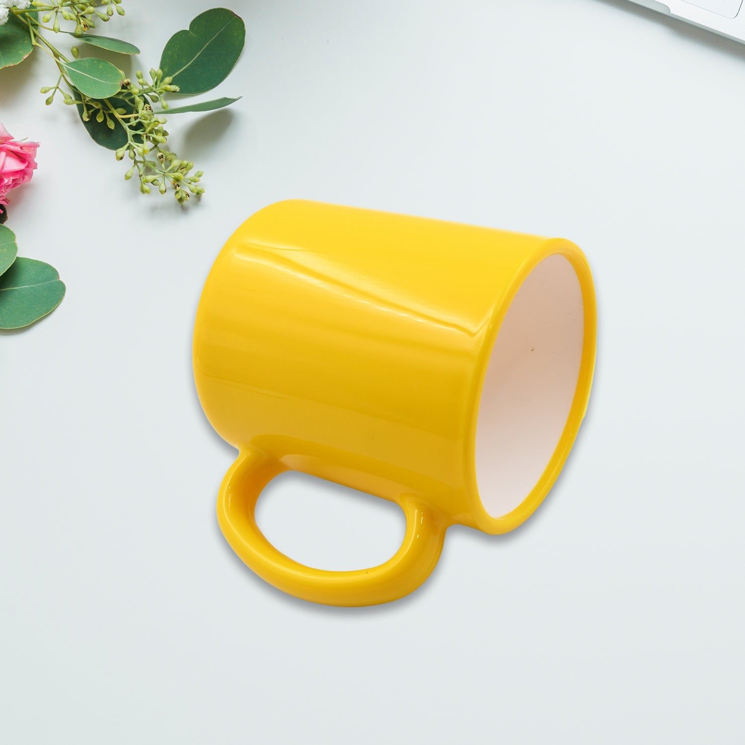 Close-up of a unique pattern on a designer coffee mug with a spoon.