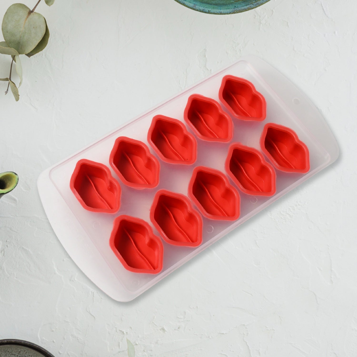 Closeup of a flexible silicone ice tray showing intricate fruit designs.