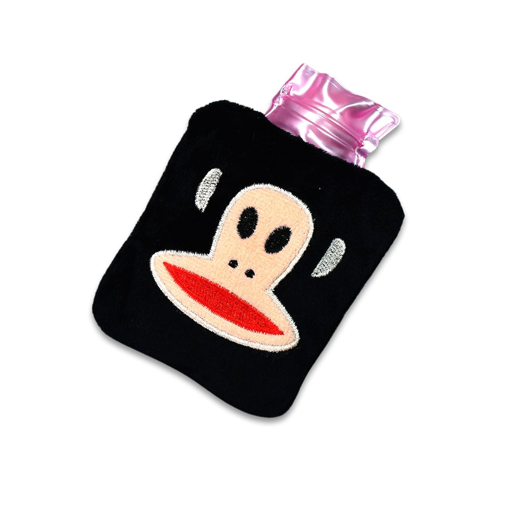 The mini hot water bag placed on a shoulder to provide muscle comfort and warmth.