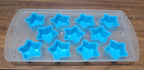 Overhead view of a silicone ice cube tray showcasing various fruit and geometric designs.