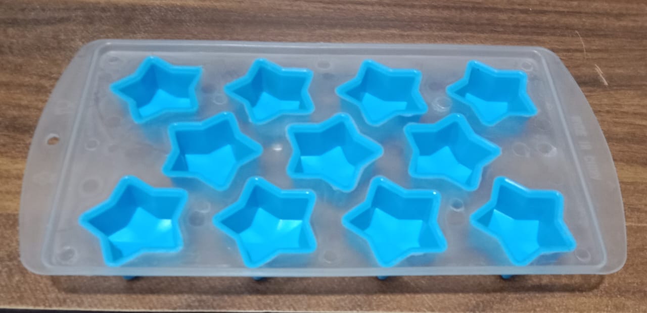 Overhead view of a silicone ice cube tray showcasing various fruit and geometric designs.