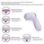 The pink 5-in-1 facial massager ready for use, highlighting its sleek design.