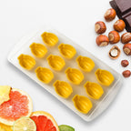 Colorful fruit-shaped ice cubes, perfectly formed from the silicone freezer mold, in a close-up shot.