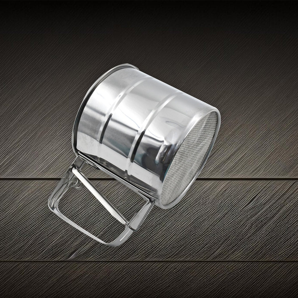 Side view of the durable flour sifter, highlighting its sturdy construction.