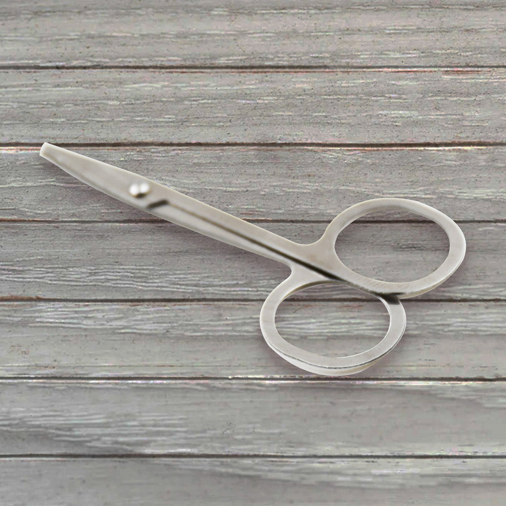 Elegant compact nail clipper set with its clear storage case for easy access.
