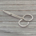 Elegant compact nail clipper set with its clear storage case for easy access.