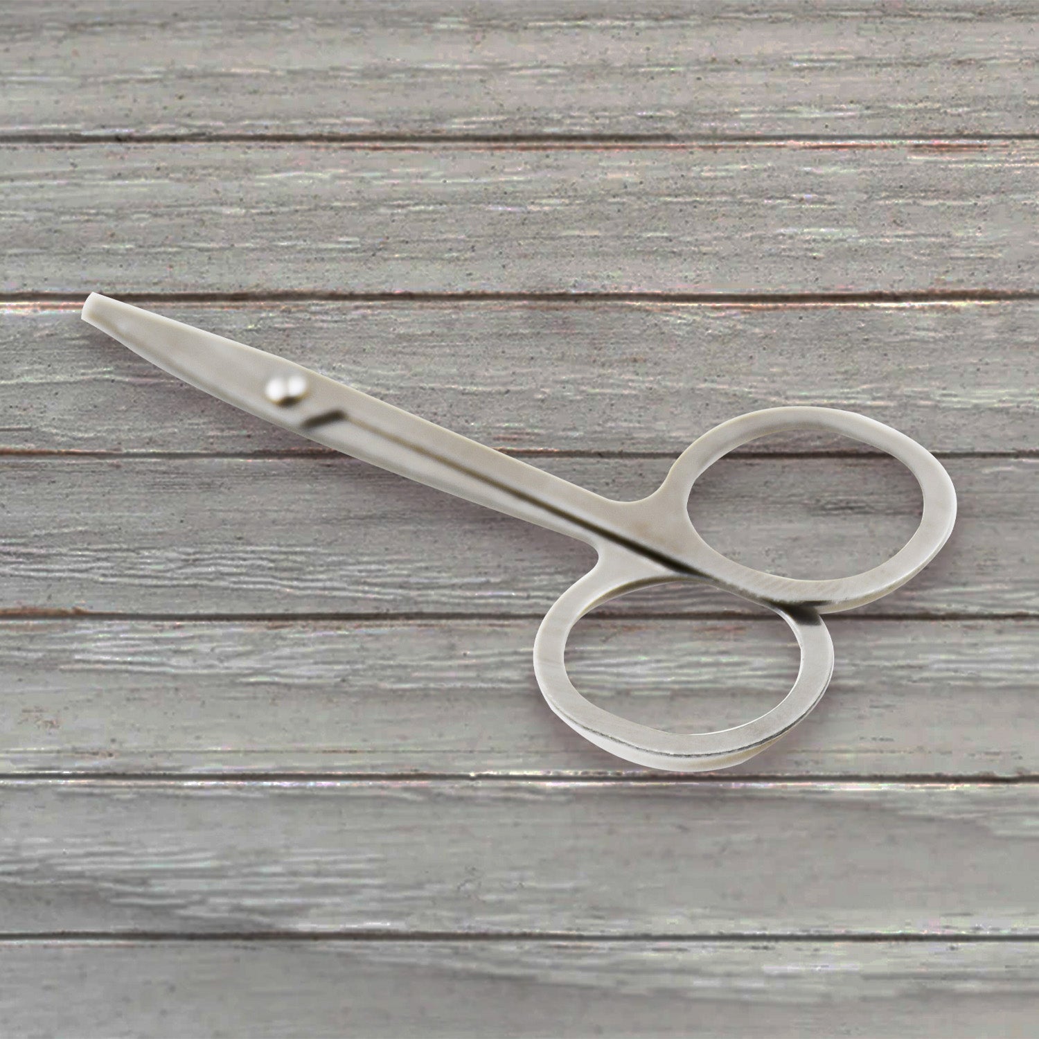 Elegant compact nail clipper set with its clear storage case for easy access.