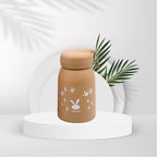 A group of three bunny print kids water bottles in various colors, showcasing design.