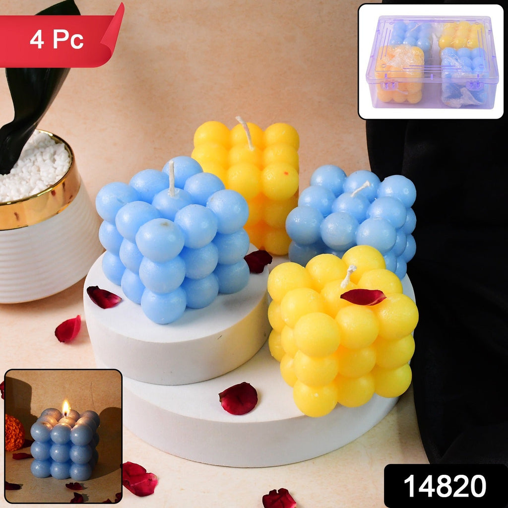 Close-up of wax cube candles showing bright blue and yellow colors