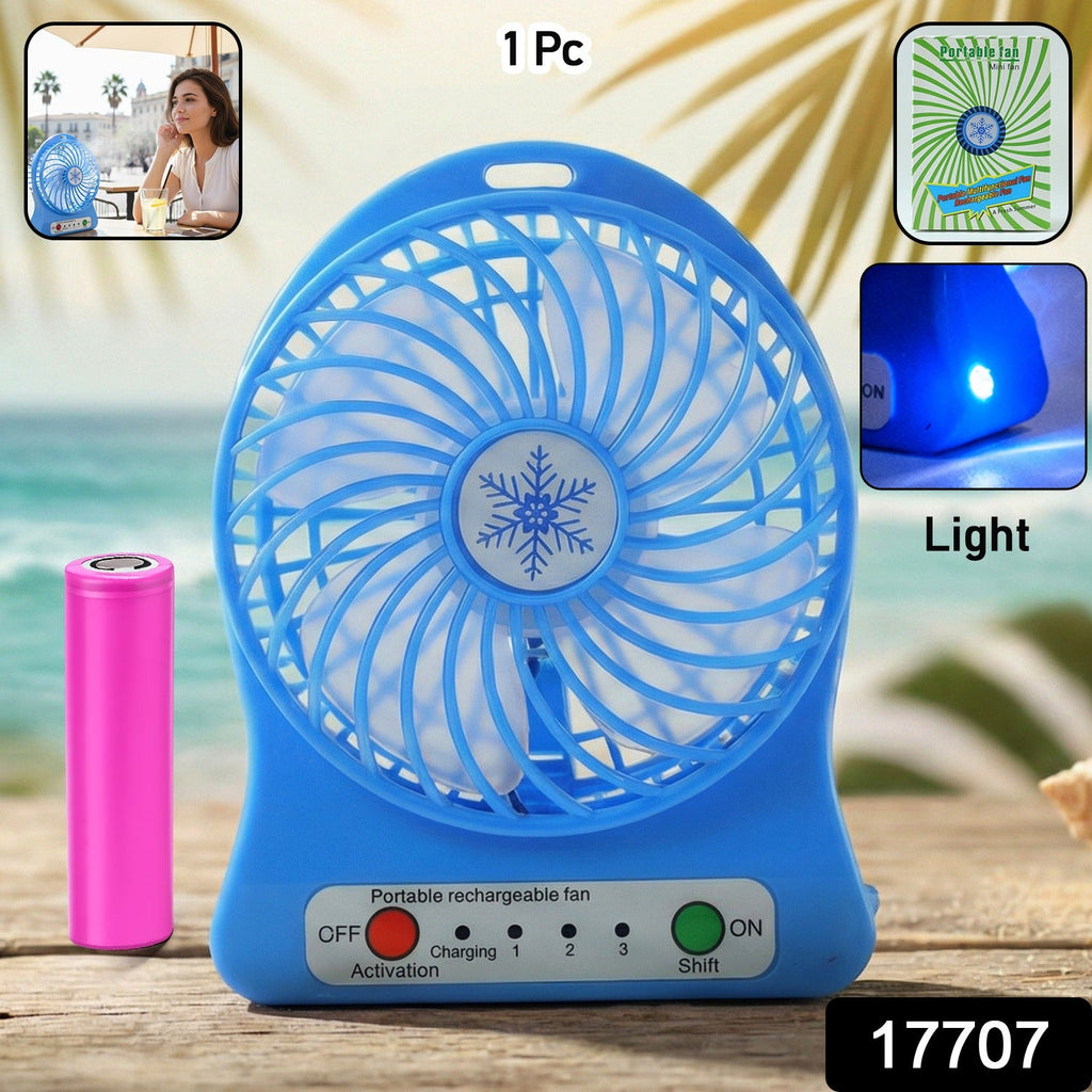 Mini table fan showing detachable rechargeable battery for portability