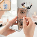 Foldable mirror keychain featuring cute elephant design with floral accents