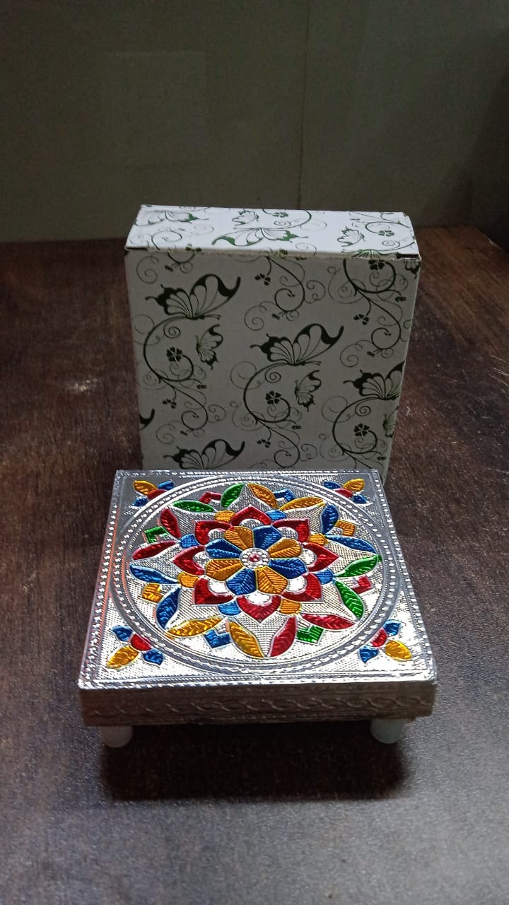 An elegant Meenakari Wooden Chowki beautifully adorning a home puja altar.