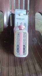 2-in-1 ice ball and cube tray mold filled with round ice spheres